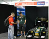 Students with the FSAE car at the Grand Prix