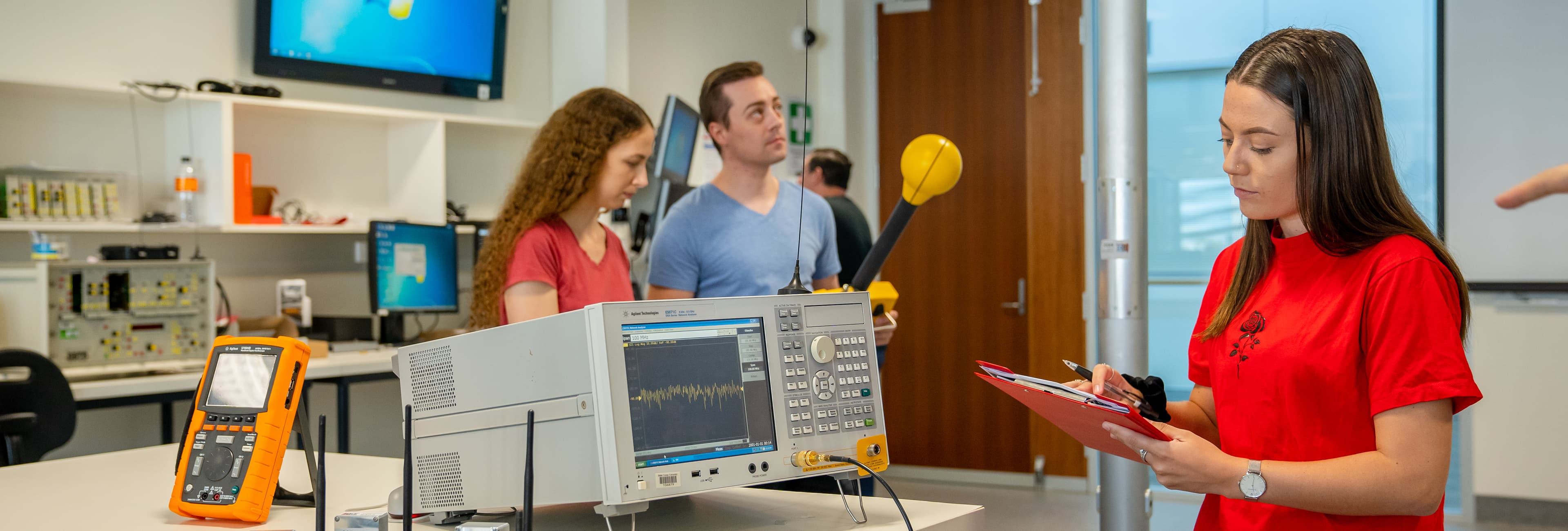 Two female and one male student in Engineering lab