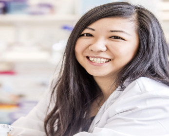 Photo of guest speaker - woman smiling with long dark hair