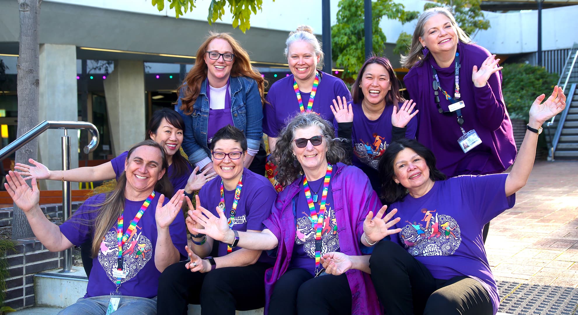 A lively group of ECU staff members dressed in purple for Wear It Purple Day.