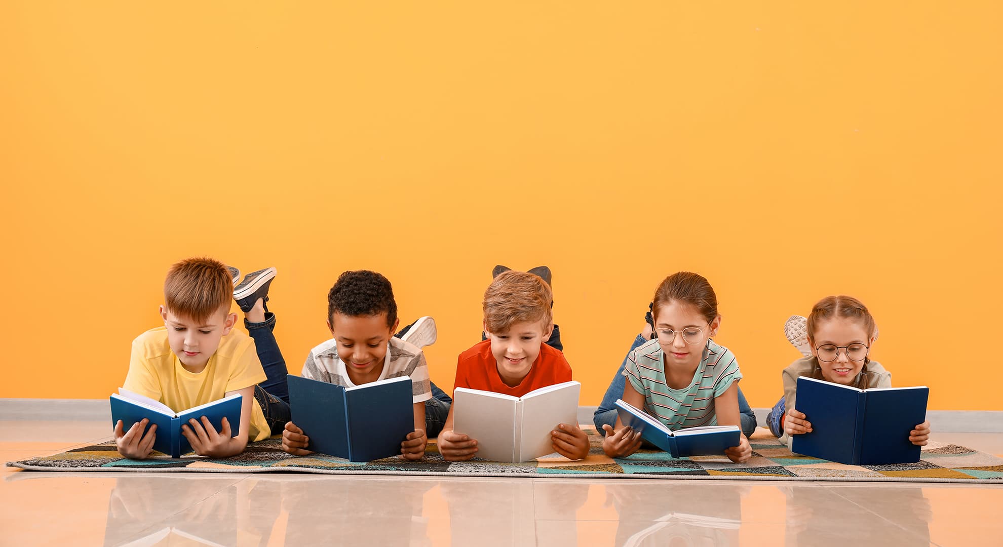 Children laying reading books