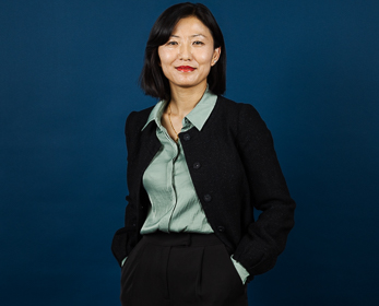 Ms Deki Choden behind a navy blue background