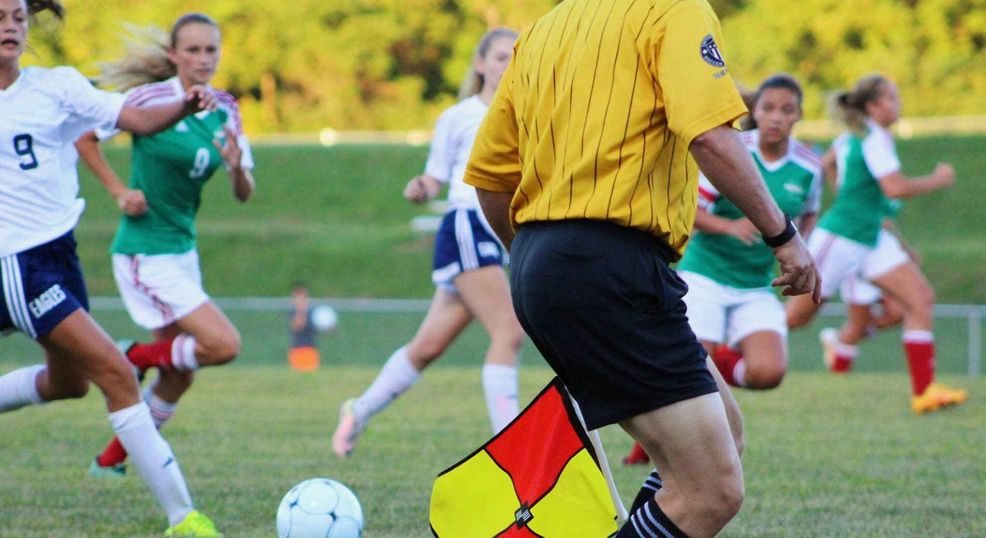 Women playing soccer.