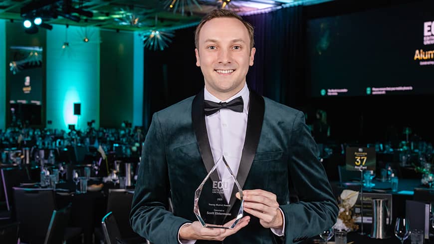 Man standing with award