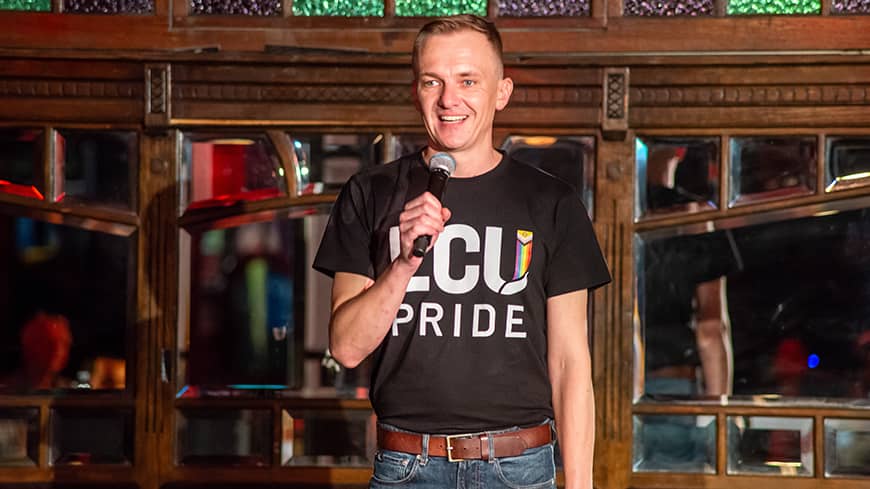 Man standing with a microphone