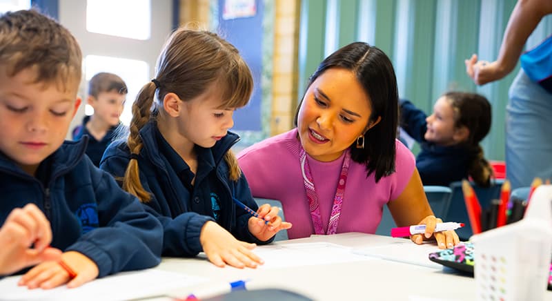 Teacher and young students