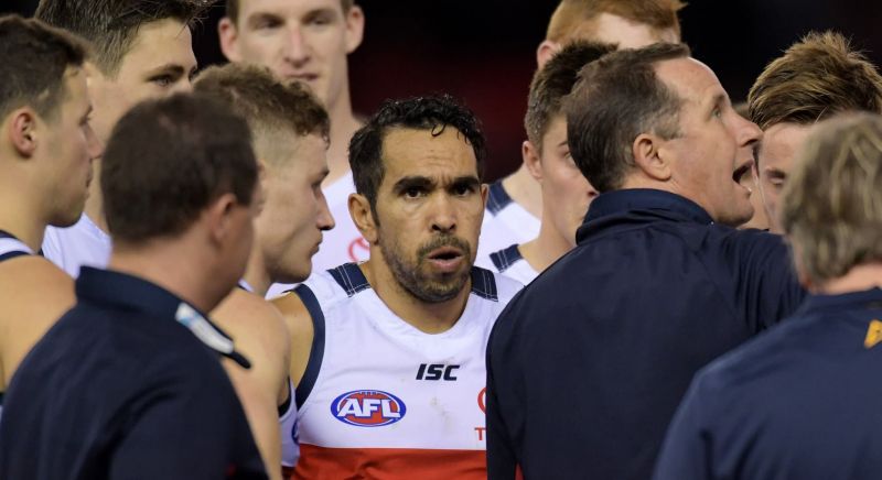 Eddie Betts in a huddle with his Adelaide Crows teammates.