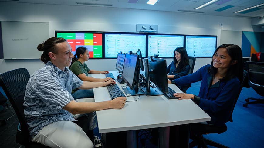 University students chatting at their desks