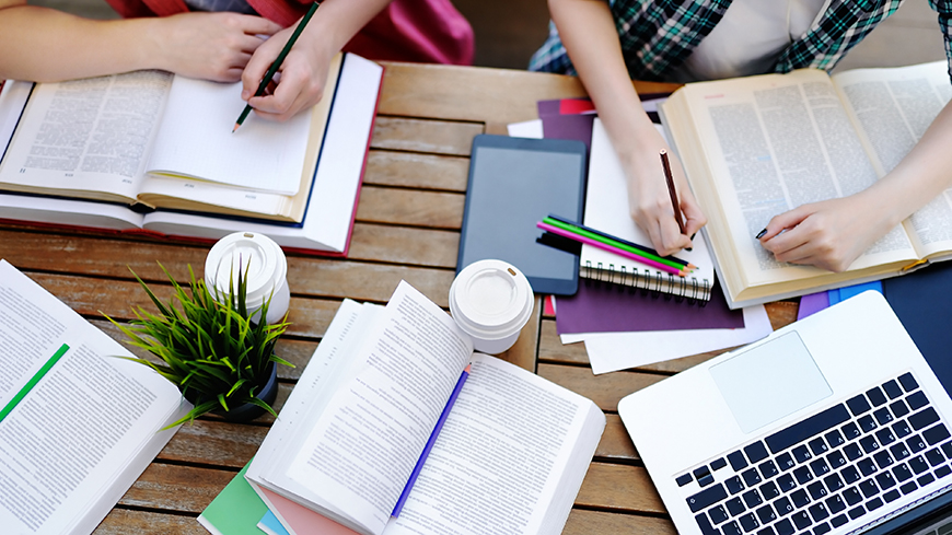 Two students working at a desk