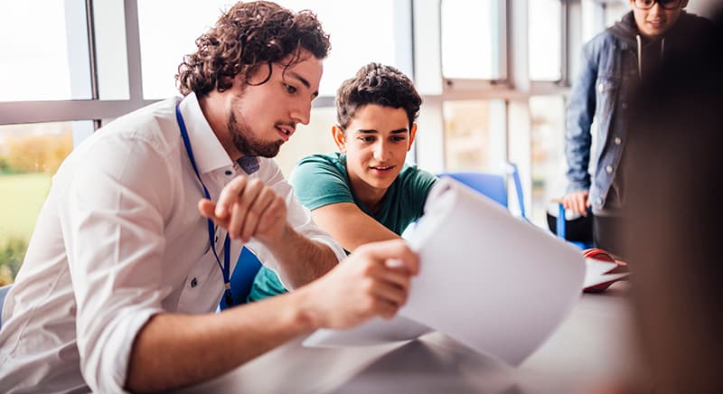 Teacher explaining to a student