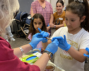 School children doing an experiment