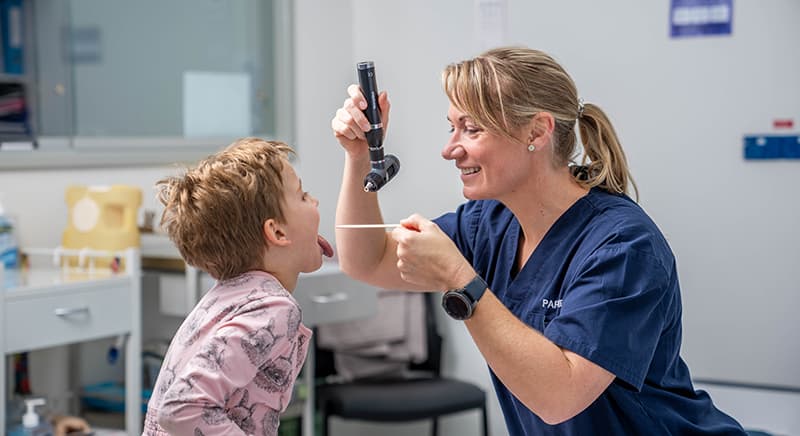 Nurse treating child