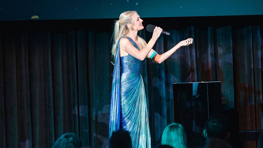 A woman singing on stage