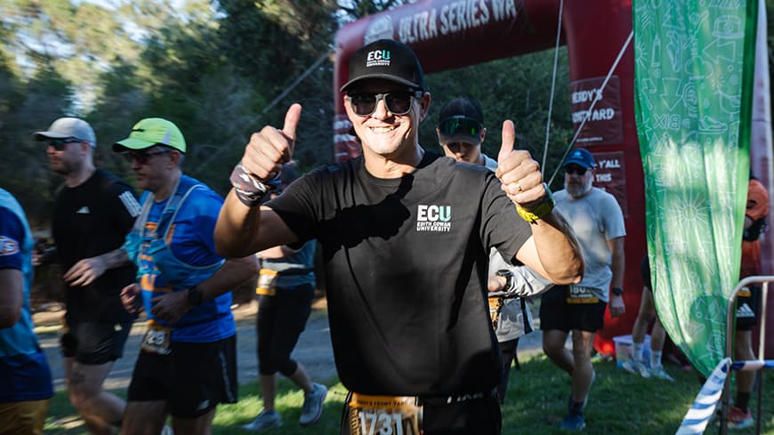 A man shows two thumbs up