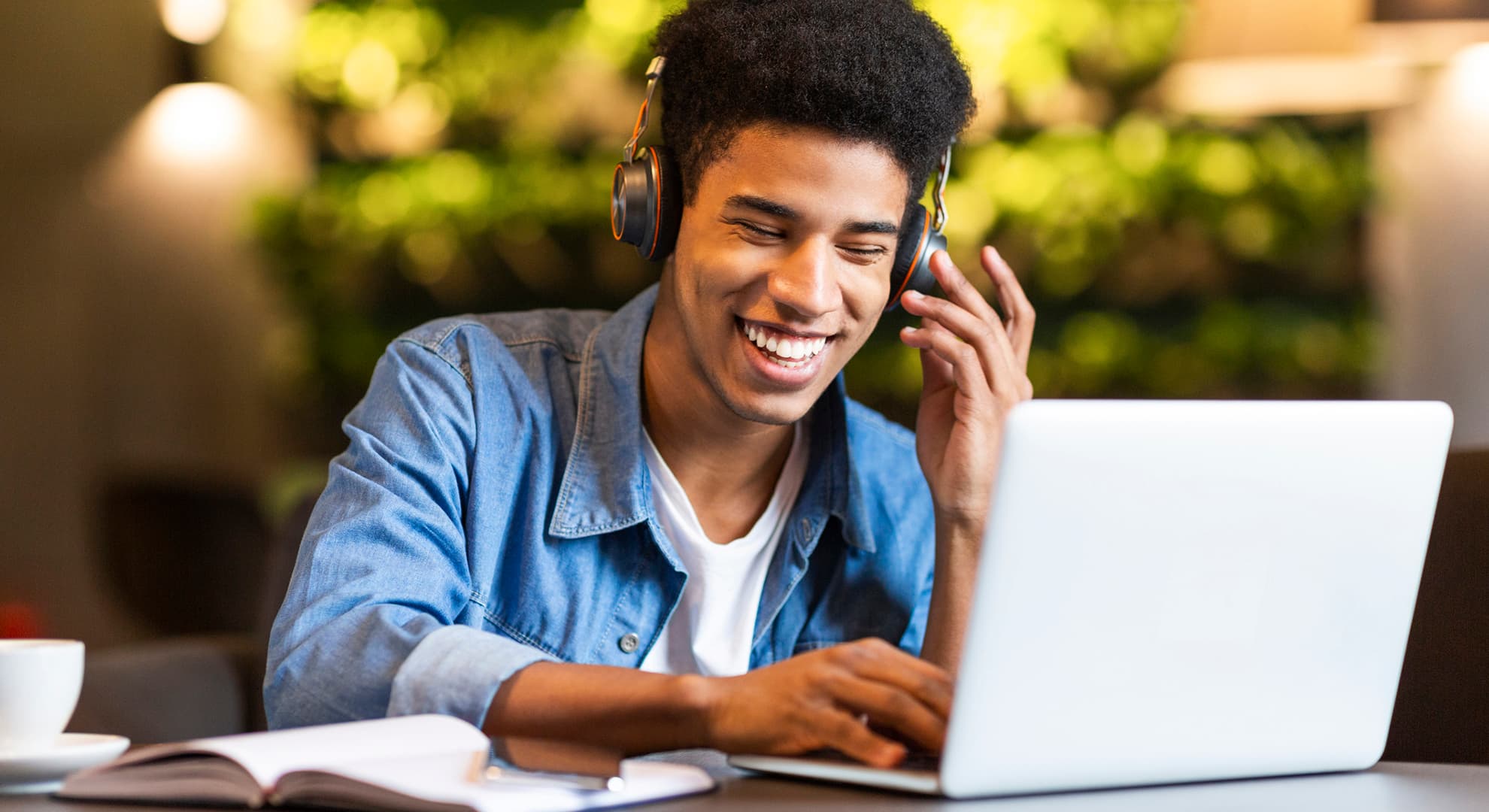 Student wearing headphones while studying.