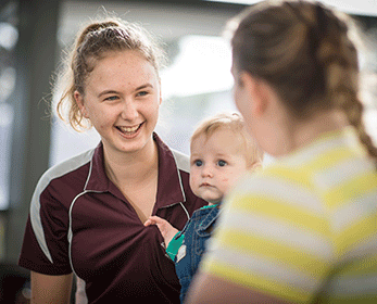 Mother and baby with an ECU Midwifery student