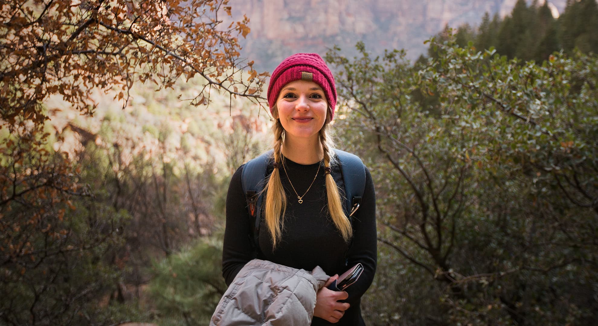 Vanessa Rogers standing in a forest.