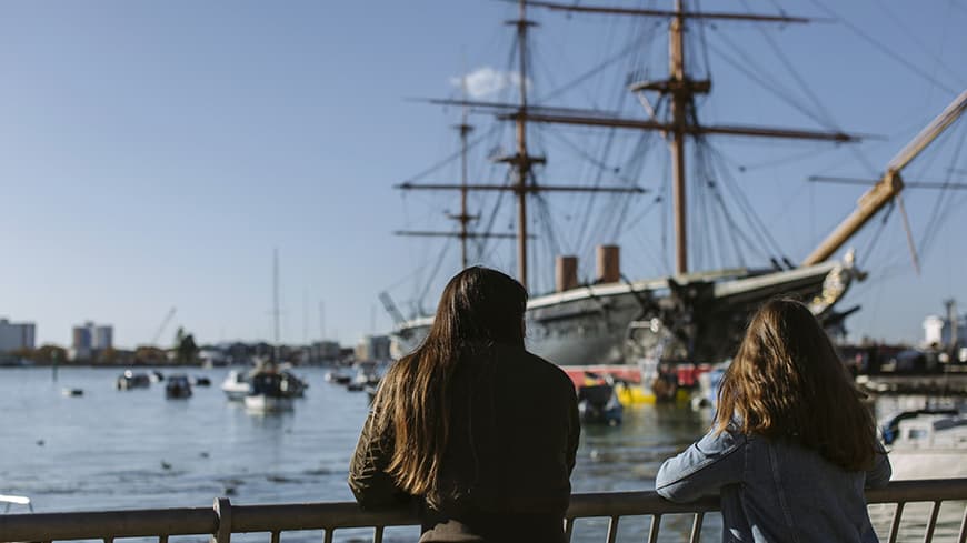 Two girls looking out over Portsmouth harbour