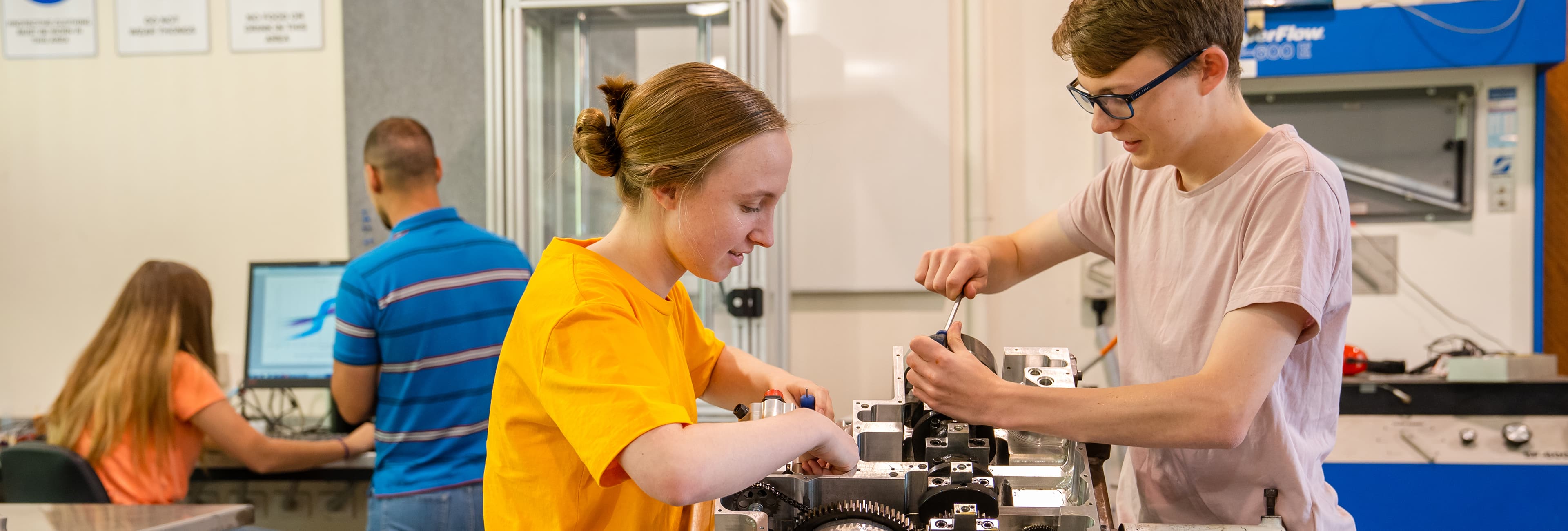 Two engineering students working in a lab