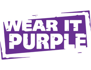 The Wear It Purple official logo states the name of the day in purple text on a white background.