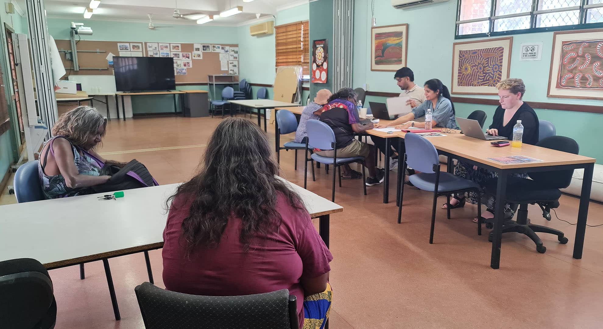 The ECU Tax Clinic with Marra Worra Worra Aboriginal Corporation filing tax returns in a community hall.