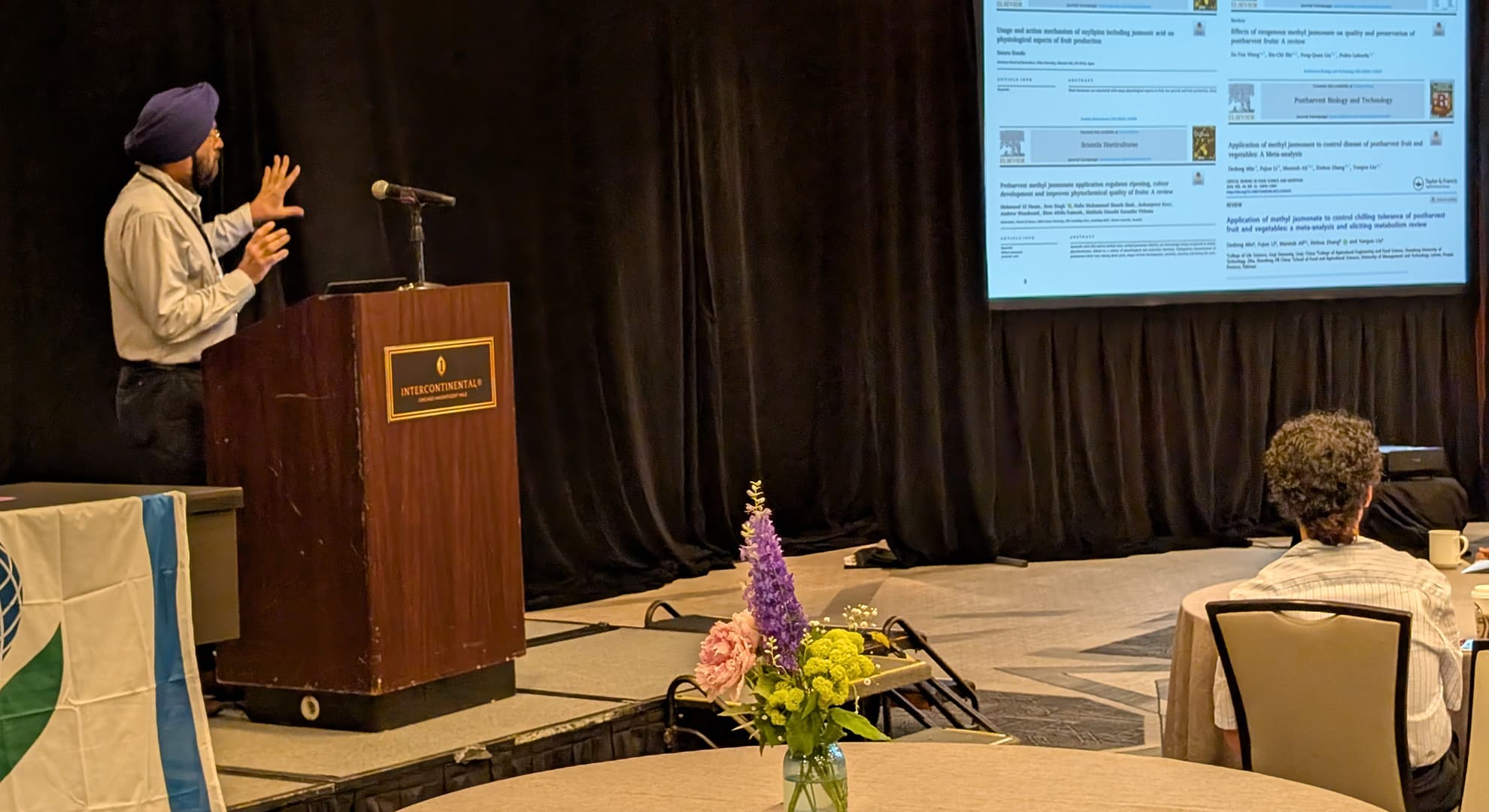 Professor standing and presenting.