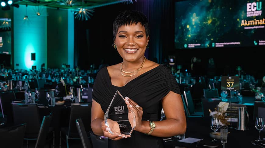 Woman standing with award