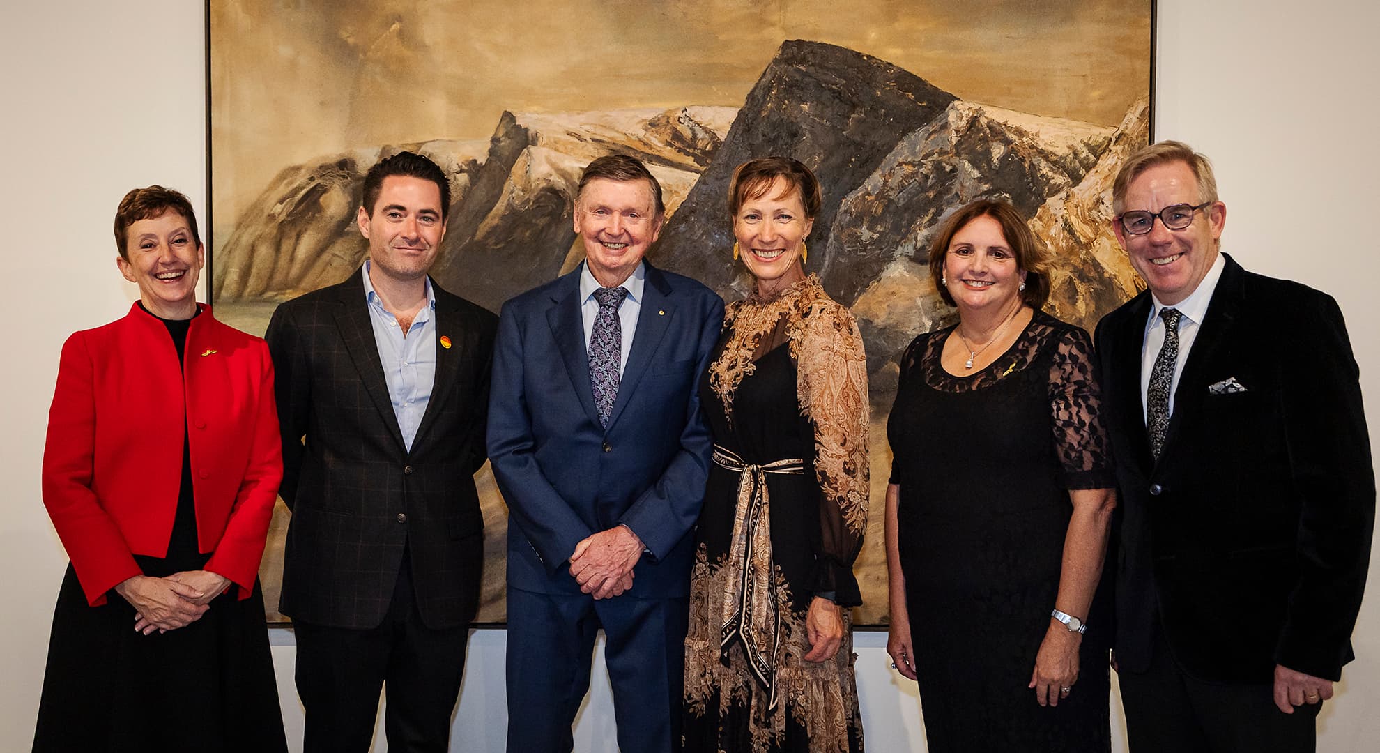 A group of people standing in a line for a photo