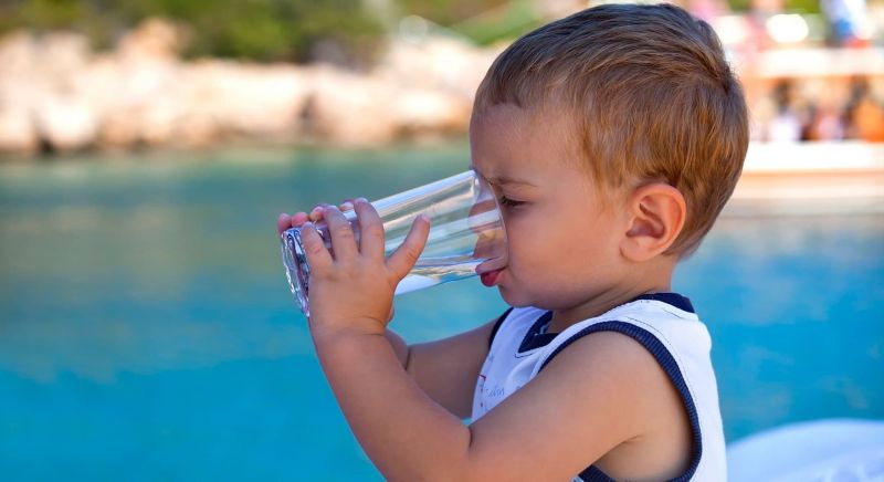Child drinking glass of water