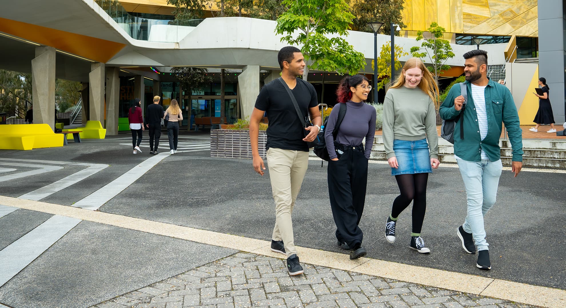 Happy ECU students walk around the Joondalup Campus.