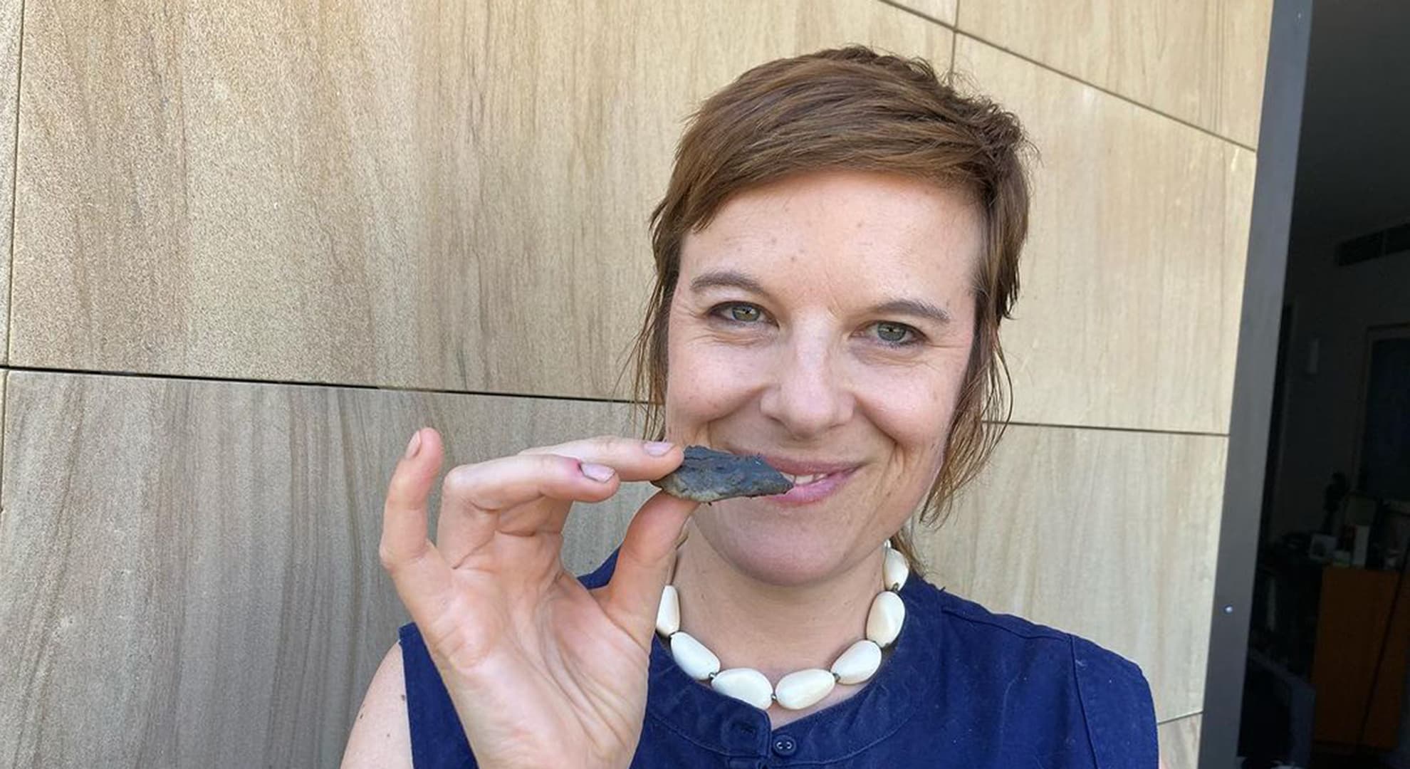 Dr Cassandra Tytler preparing dirt cookies for Soiled exhibition