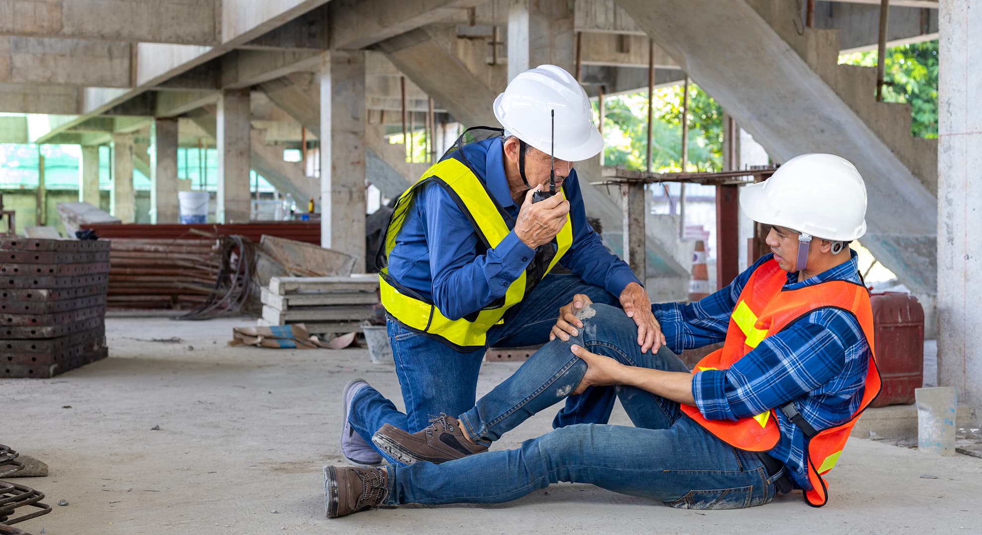 A man attending to an injured co-worker.