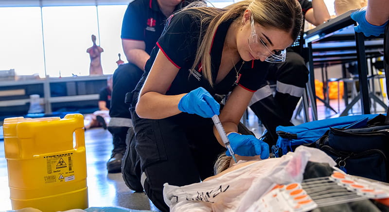 Paramedicine student in a practice room