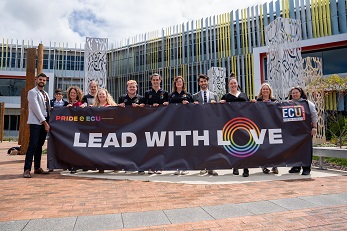 ECU Staff and Students holdings ECU's 2019 pride parade banner that reads Lead with Love 