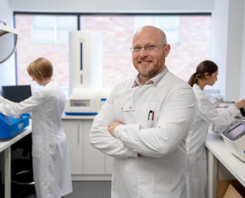 Group Lead, Professor Simon Laws, with members of the group in the research laboratories at the Sarich Neuroscience Research Institute.