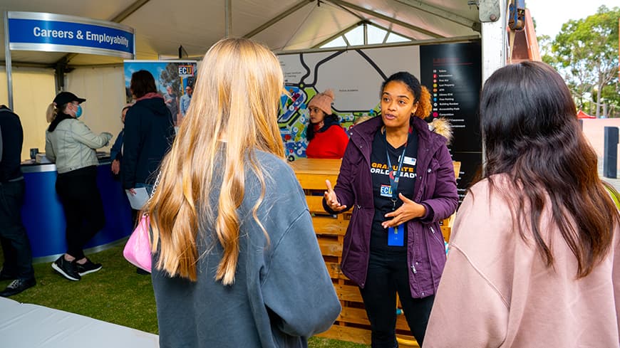 Woman explaining career options to two younger women