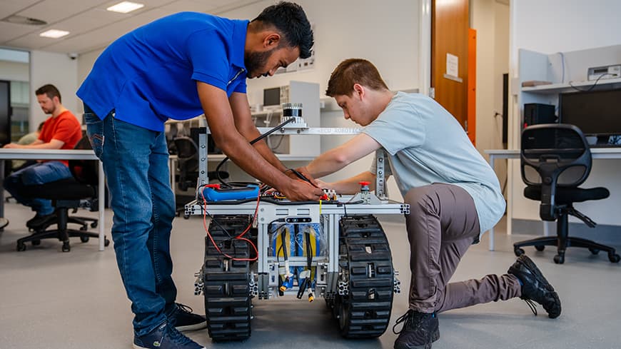 Two male engineering students in a laboratory