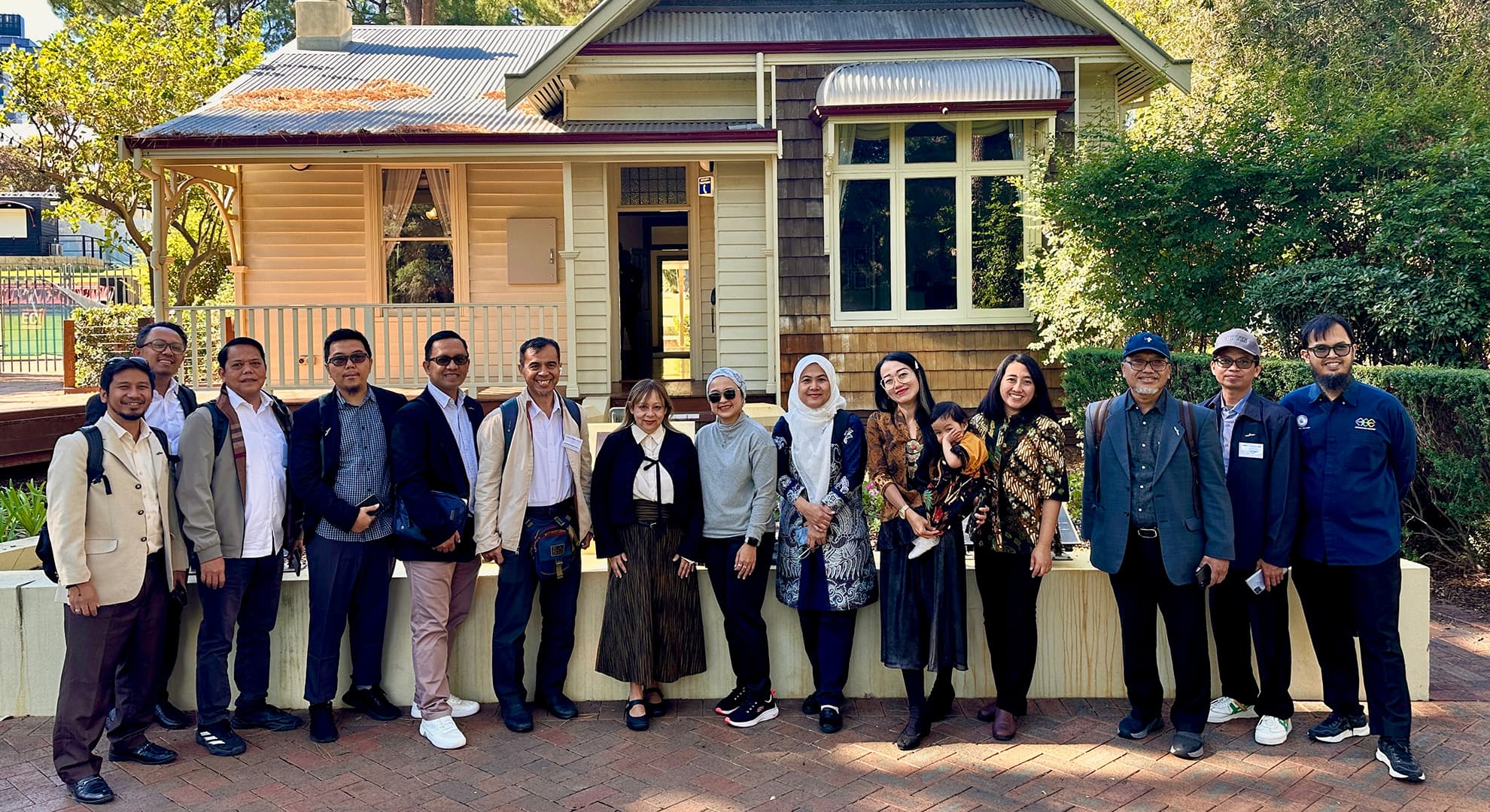 A group of senior researchers from East Java stand outside Edith Cowan House on the ECU Joondalup campus.