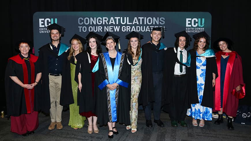 A group of people in academic gowns standing in a line