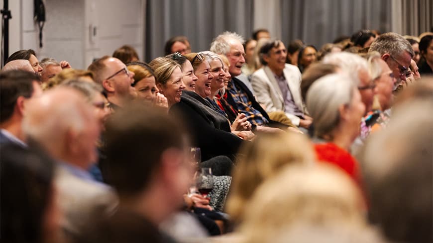 Shot of the audience laughing