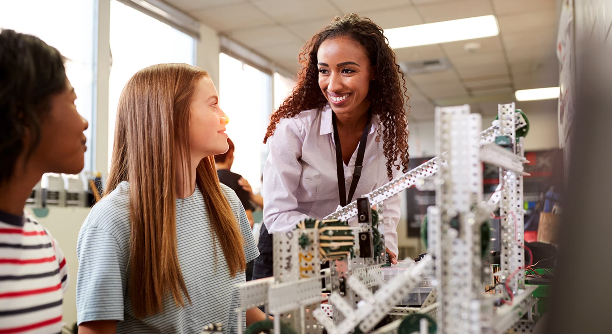 Lecturer and students in engineering lab