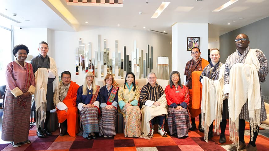ECU delegates with Her Majesty the Queen Mother Sangay Choden Wangchuck of Bhutan wearing traditional Bhutanese clothing.