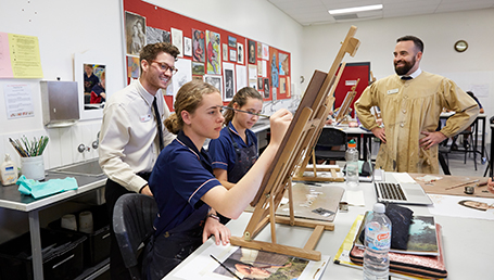 Secondary teaching student, Alexander Gibbs with high school arts students on a teaching practicum.