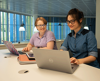 Students in the library on their laptops