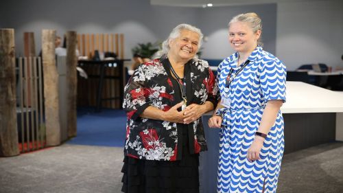 Dr Roma Yibiyung Winmar, Elder-in-Residence and Amy Cairns, Librarian: Digital and Information Literacy outside Kaarla Mia.