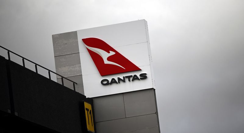 Qantas logo at an airport.