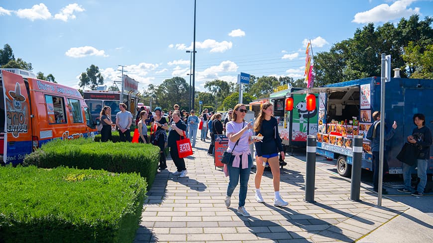 Food trucks serving people