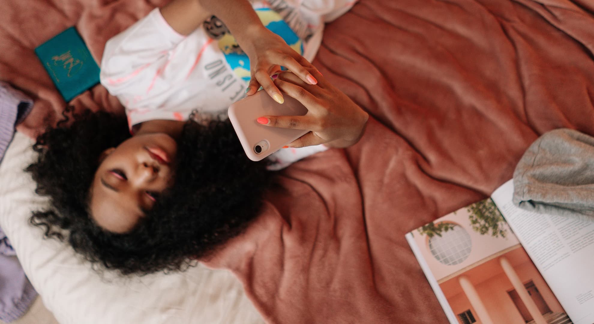 Teenagers laying down on mobile phone