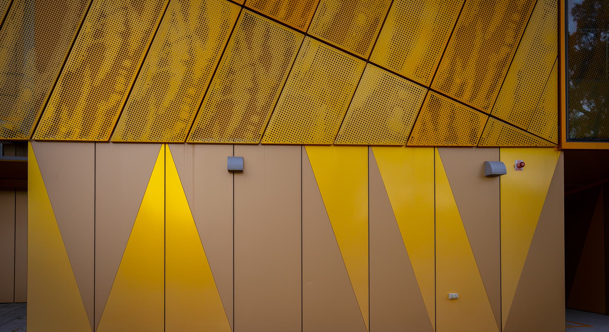 Gold geometric patterns on a building.