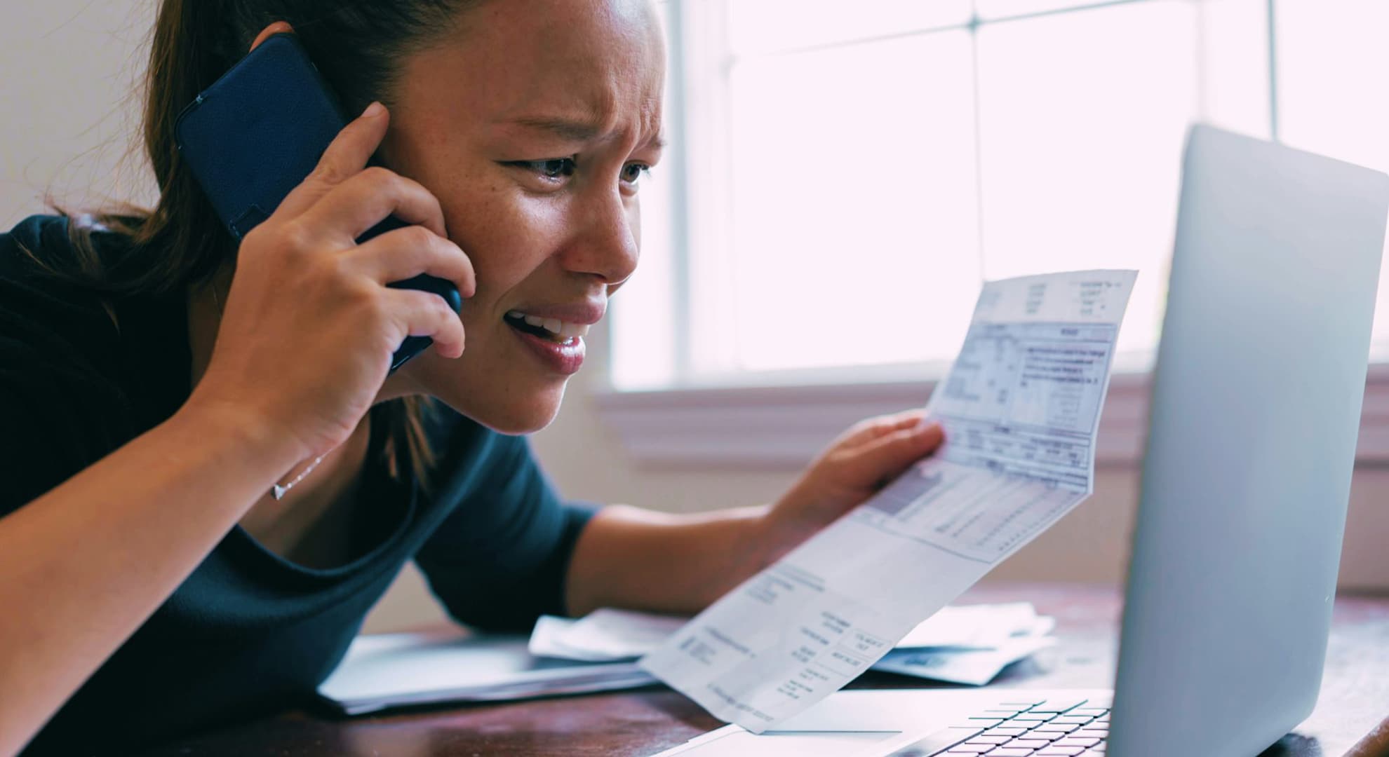 Worried woman on phone.